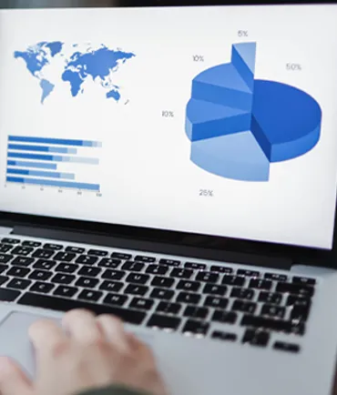 World Map Next To Graphs on a computer screen representing google analytics